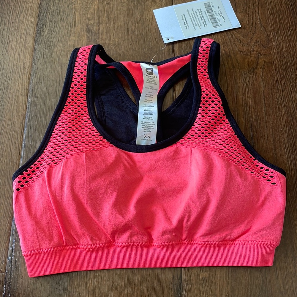 Fabletics Lundra sports bra. Size extra small. Color is neon pink